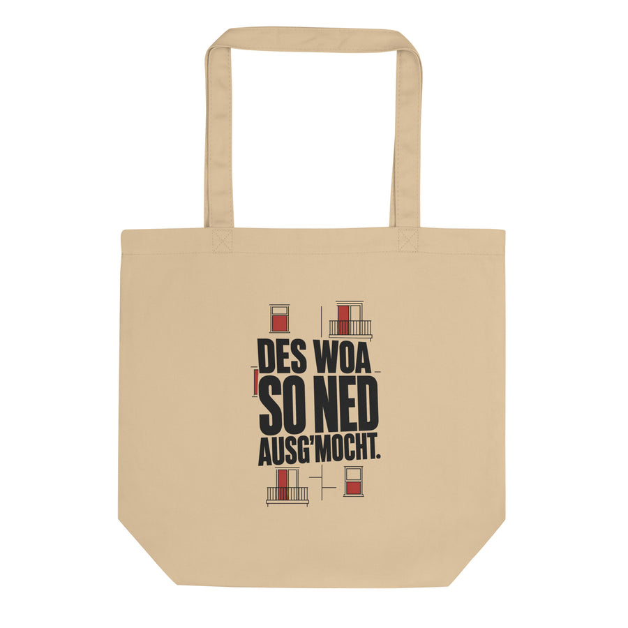 Bio-Stofftasche im Naturton Oyster mit schwarzem Schriftzug „Des woa so ned ausg'mocht." und roten Wiener Altbaufenstern